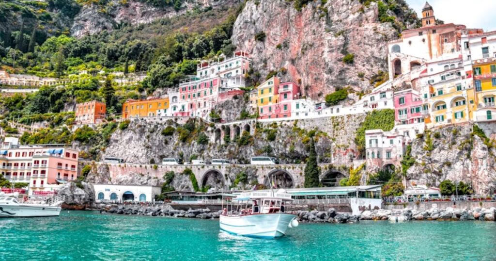 White boat on body of water near green and brown mountain during daytime, Amalfi Coast